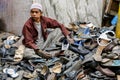 Young boy looking after shoes outside Ajmer mosque