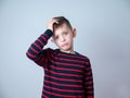 Young boy looking thoughtful or worried Royalty Free Stock Photo