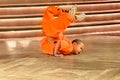 Young boy monk at magical acrobatic power show - Shaolin Kung Fu Show