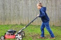 Young Boy Mowing Lawn