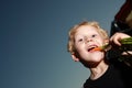 Young boy munching a carrot Royalty Free Stock Photo