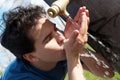 Young boy near a drinking fountain with water