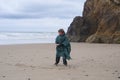 Young Boy on Oregon Beach on a Wet Day Royalty Free Stock Photo