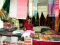 Young Boy Owner Standing in his Boutique Fabric/Clothes Shop