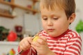 Young boy peeling potato