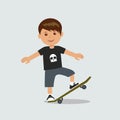 A young boy performs a trick on a skateboard