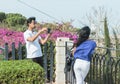 Young boy photographing a young girl on his mobile phone in Haifa, Israel Royalty Free Stock Photo