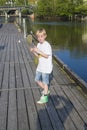 Young boy on the pier at the tista river Royalty Free Stock Photo