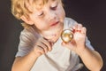 Young boy play with fidget spinner stress relieving toy Royalty Free Stock Photo