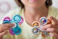 Young boy play with fidget spinner stress relieving toy Royalty Free Stock Photo