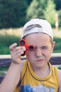 Young boy play with fidget spinner stress relieving toy Royalty Free Stock Photo