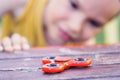 Young boy play with fidget spinner stress relieving toy Royalty Free Stock Photo