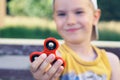 Young boy play with fidget spinner stress relieving toy Royalty Free Stock Photo