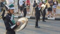 A young boy playiing cymbal in marching band