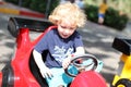 Young boy playing with bumper car Royalty Free Stock Photo