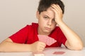 Young boy playing cards Royalty Free Stock Photo