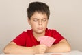 Young boy playing cards Royalty Free Stock Photo