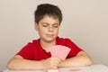 Young boy playing cards Royalty Free Stock Photo