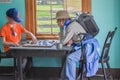 Young Boy Playing Checkers with Grandma