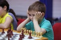 Young boy playing chess