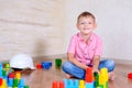 Young boy playing with colorful building blocks Royalty Free Stock Photo