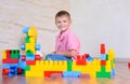 Young boy playing with colorful building blocks Royalty Free Stock Photo