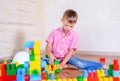 Young boy playing with colorful building blocks Royalty Free Stock Photo