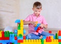 Young boy playing with colorful building blocks Royalty Free Stock Photo