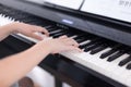 Young boy playing on a digital piano Royalty Free Stock Photo