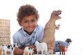 Young boy playing dinosaur