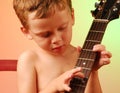 Young boy playing guitar Royalty Free Stock Photo