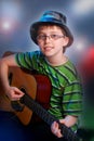 Young boy playing guitar Royalty Free Stock Photo