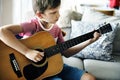 Young boy playing guitar solo Royalty Free Stock Photo