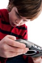 Young boy playing handheld game console Royalty Free Stock Photo