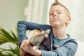 Young boy playing his guitar for the camera Royalty Free Stock Photo