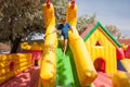 Young boy playing in an inflatable toy house in a park Royalty Free Stock Photo