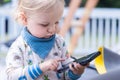 Young boy playing with mobile phone Royalty Free Stock Photo