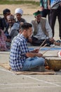 A young boy playing Nagara (a kind of drum) in local festival of Kullu, Himachal Pradesh.