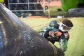 Young boy playing paintball