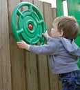 Young boy playing on playground Royalty Free Stock Photo