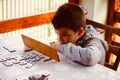 Young boy playing Rummy