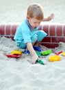 Young boy playing in the sandbox Royalty Free Stock Photo