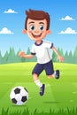A young boy is playing soccer and kicking a ball Royalty Free Stock Photo
