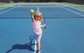 Young boy playing tennis. Kid hitting forehand in tennis. Royalty Free Stock Photo