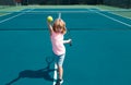 Young boy playing tennis. Kid hitting forehand in tennis. Royalty Free Stock Photo