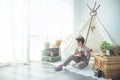 Young boy playing ukulele at home Royalty Free Stock Photo