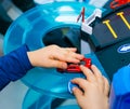 Young boy playing with vintage toy cars at home. Selective focus on hand of boy and toy. Royalty Free Stock Photo