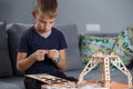 Young boy playing with eco wooden constructor