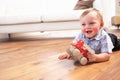 Young Boy Playing With Wooden Toy Car At Home Royalty Free Stock Photo