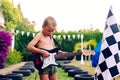 Young boy plays a piece to the electric guitar, very concentrated in his interpretation, dressed in a swimsuit